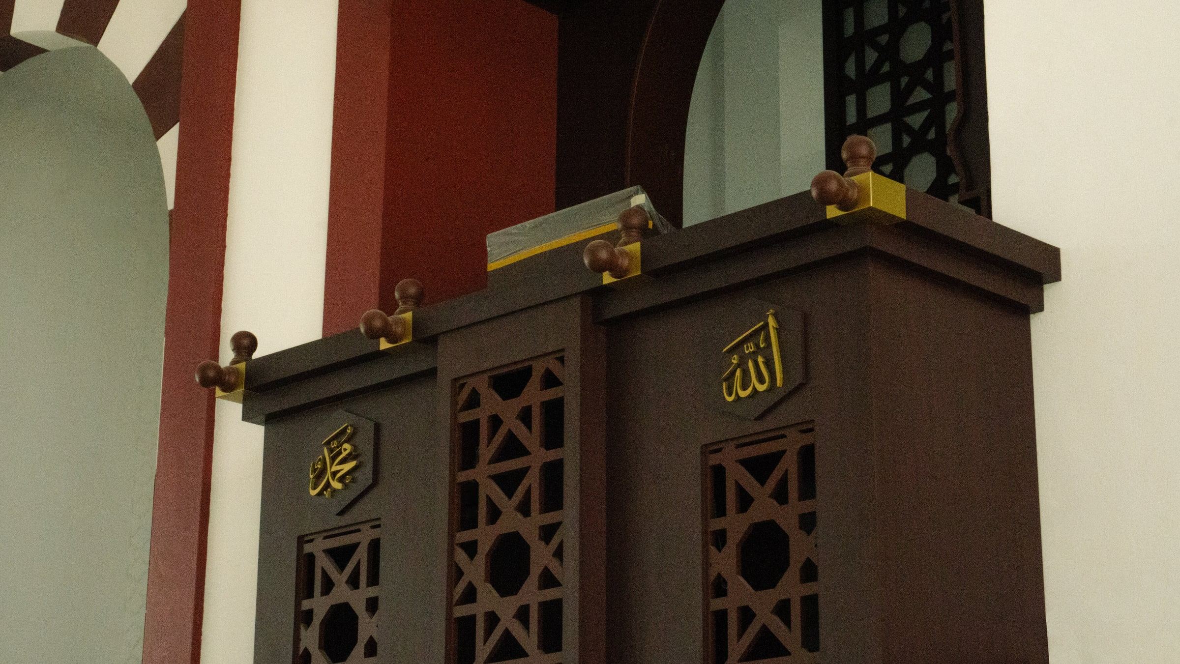 Timber mimbar at Masjid Baru RPN Kg Rimba with gold calligraphy panels, lattice openings and turned finials